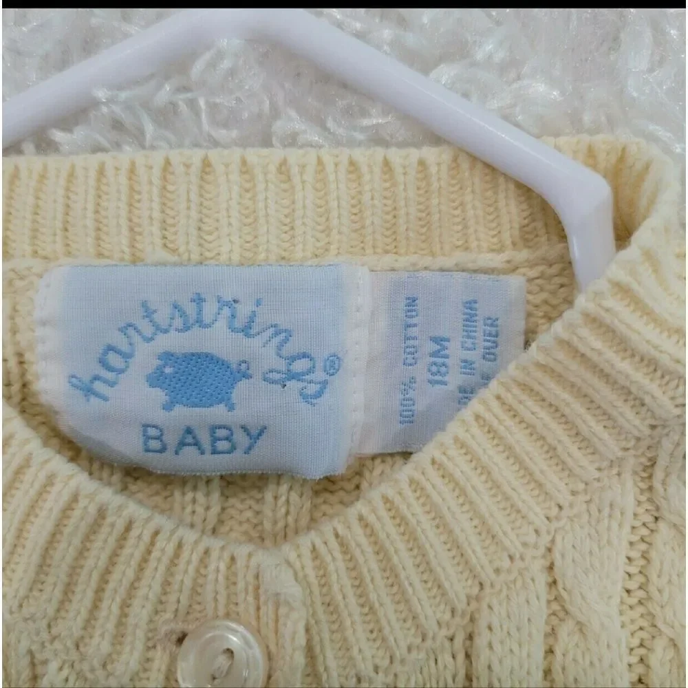 Pale yellow cardigan/ sweater